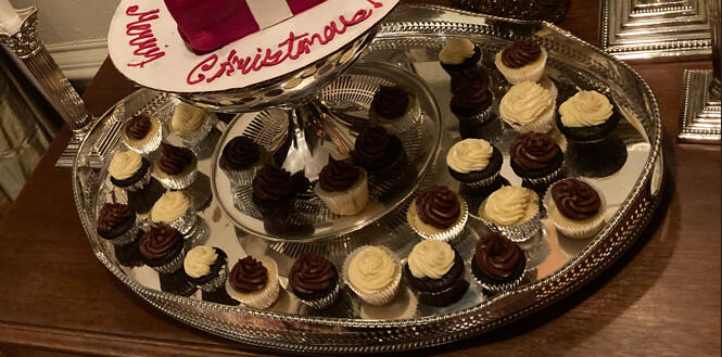 a silver plater of chocolate and vanilla cupcakes